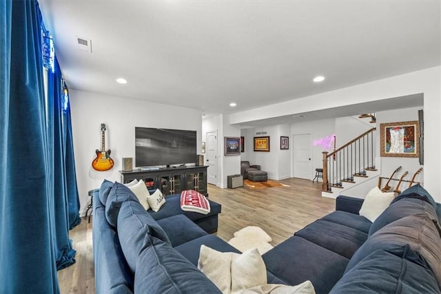 2428 W 179th St, Overland Park, KS 66085 - living room with stairs, light wood-style flooring, and recessed lighting