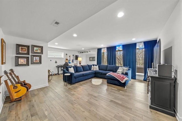 2428 W 179th St, Overland Park, KS 66085 - living area with light wood-type flooring, recessed lighting, and baseboards