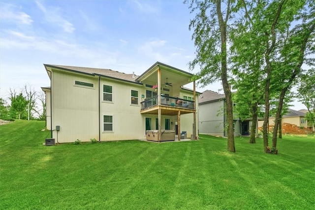 2428 W 179th St, Overland Park, KS 66085 - rear view of house featuring a jacuzzi, a ceiling fan, a yard, and a balcony