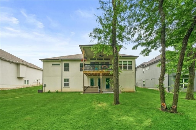 2428 W 179th St, Overland Park, KS 66085 - back of property with a ceiling fan, a lawn, a hot tub, and a deck