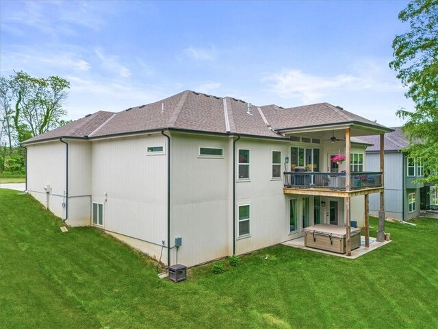 2428 W 179th St, Overland Park, KS 66085 - back of property featuring a ceiling fan, a lawn, a patio, and roof with shingles