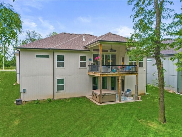 2428 W 179th St, Overland Park, KS 66085 - rear view of house featuring a hot tub, a ceiling fan, and a yard