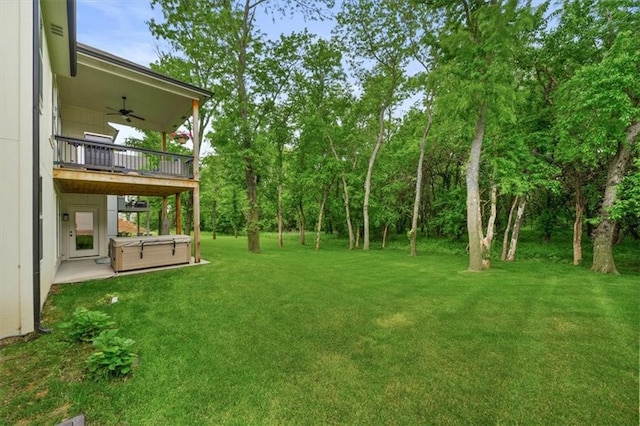 2428 W 179th St, Overland Park, KS 66085 - view of green lawn featuring a hot tub, a ceiling fan, and a patio area