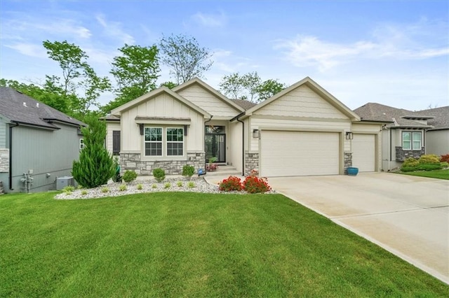 2428 W 179th St, Overland Park, KS 66085 - view of front facade featuring an attached garage, a front yard, driveway, stone siding, and board and batten siding
