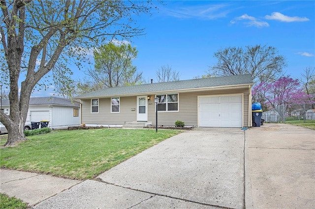 single story home with a front lawn, driveway, and an attached garage