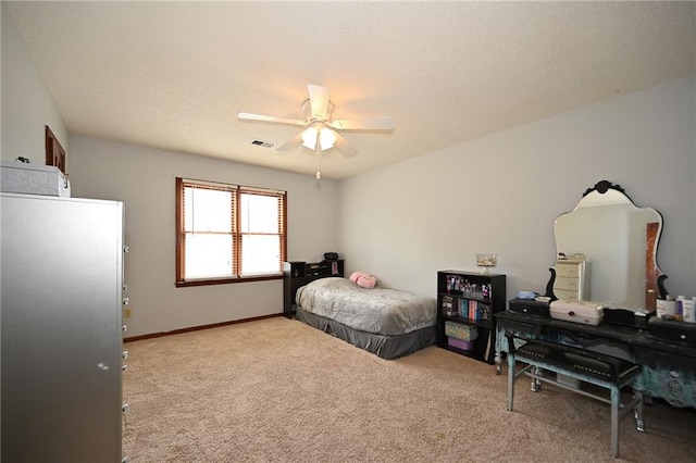 2406 NE 78th Ter, Kansas City, MO 64118 - carpeted bedroom with a ceiling fan and baseboards