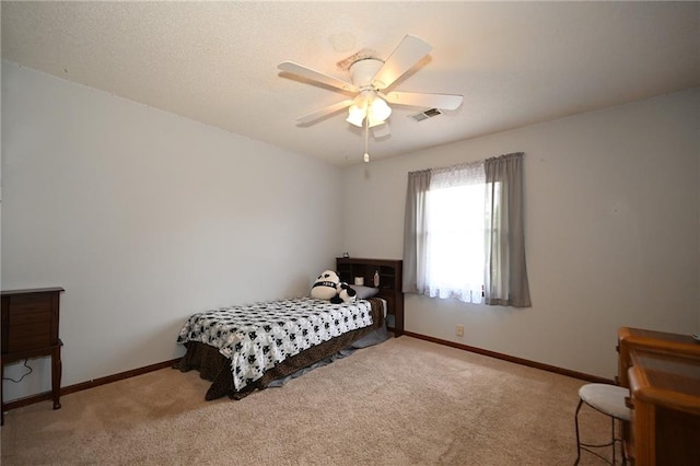 2406 NE 78th Ter, Kansas City, MO 64118 - carpeted bedroom with baseboards and a ceiling fan