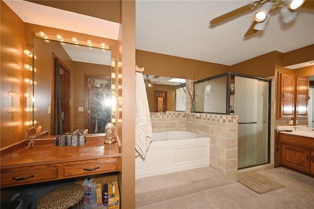 2406 NE 78th Ter, Kansas City, MO 64118 - full bath featuring a ceiling fan, vanity, a shower stall, and a garden tub