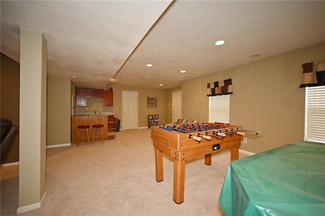2406 NE 78th Ter, Kansas City, MO 64118 - playroom with wet bar, recessed lighting, baseboards, and light carpet