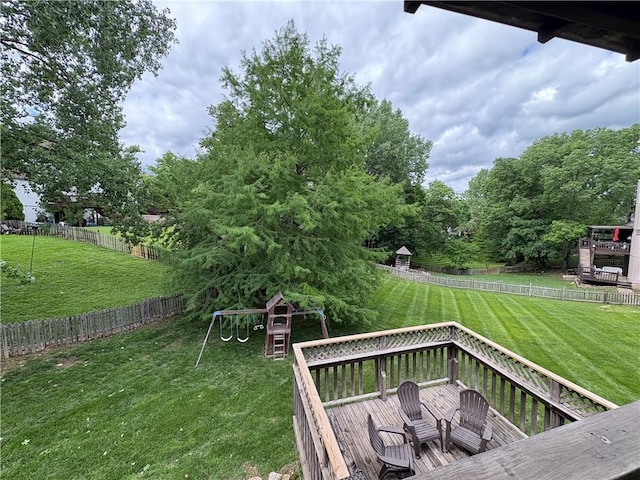 2406 NE 78th Ter, Kansas City, MO 64118 - view of yard with a playground and a wooden deck
