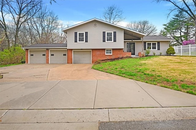 510 S 17th St, Leavenworth, KS 66048 - split level home with concrete driveway and brick siding