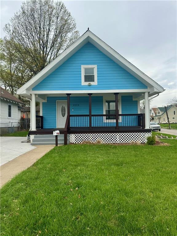 2518 N 12th St, Kansas City, KS 66104 - view of front facade with a front lawn and a porch