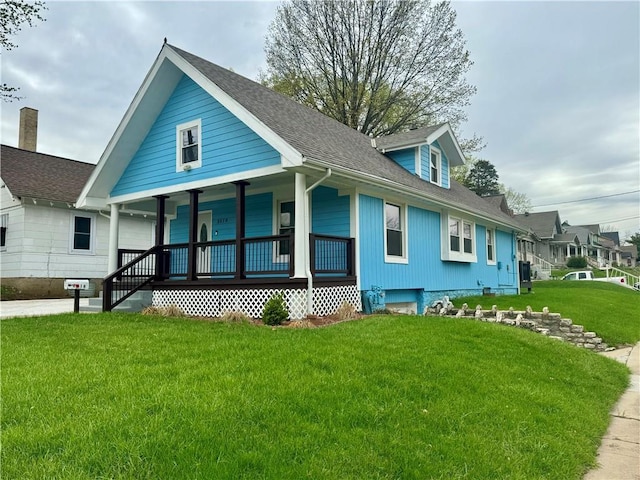 2518 N 12th St, Kansas City, KS 66104 - exterior space featuring a front lawn, a porch, and roof with shingles
