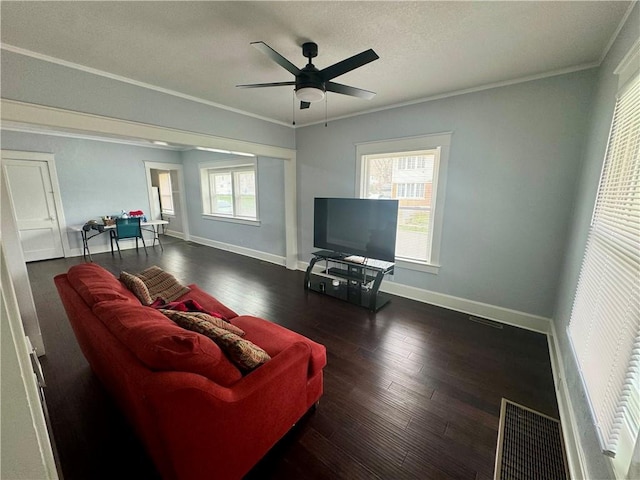 2518 N 12th St, Kansas City, KS 66104 - living room featuring ornamental molding, baseboards, ceiling fan, and wood finished floors