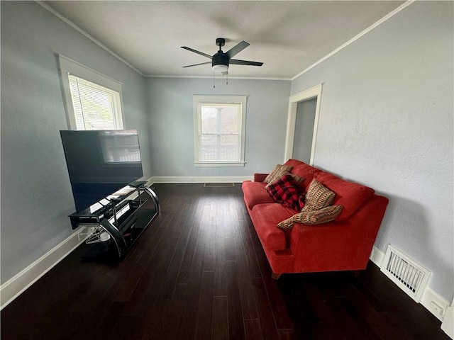 2518 N 12th St, Kansas City, KS 66104 - living area with crown molding, hardwood / wood-style floors, baseboards, ceiling fan, and visible vents