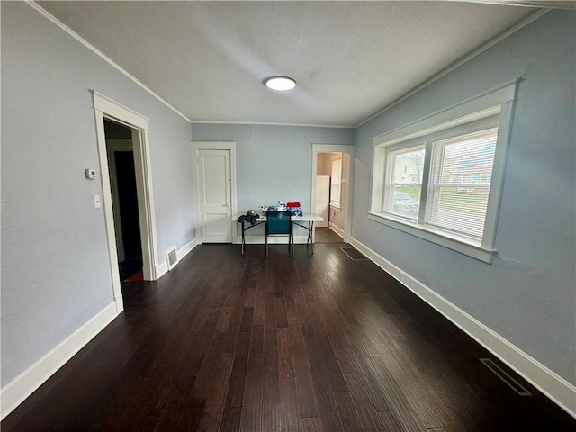 2518 N 12th St, Kansas City, KS 66104 - interior space with dark wood finished floors, baseboards, visible vents, and ornamental molding