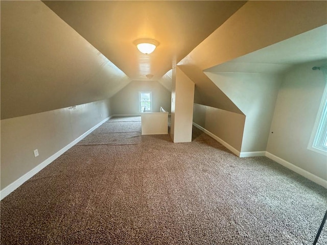 2518 N 12th St, Kansas City, KS 66104 - additional living space with baseboards, carpet flooring, and vaulted ceiling