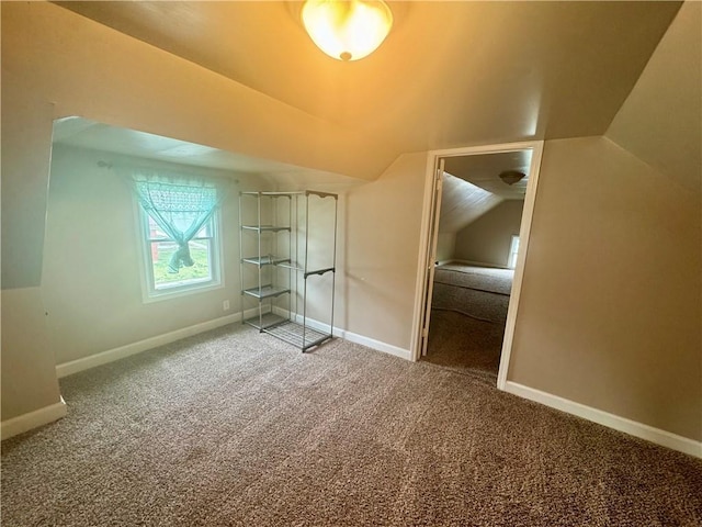 2518 N 12th St, Kansas City, KS 66104 - unfurnished bedroom featuring baseboards, carpet floors, and vaulted ceiling