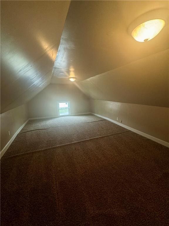 2518 N 12th St, Kansas City, KS 66104 - bonus room with baseboards, carpet flooring, and vaulted ceiling