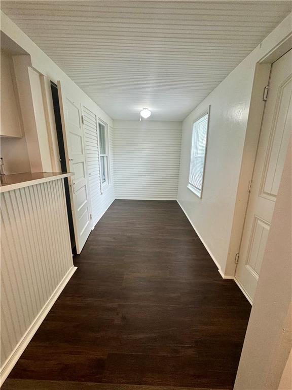 2518 N 12th St, Kansas City, KS 66104 - hall featuring dark wood-type flooring