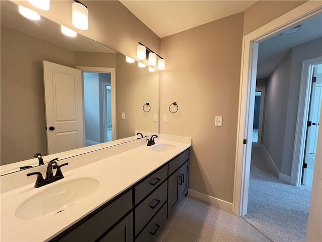 16965 S Mahaffie St, Olathe, KS 66062 - full bathroom with double vanity and baseboards