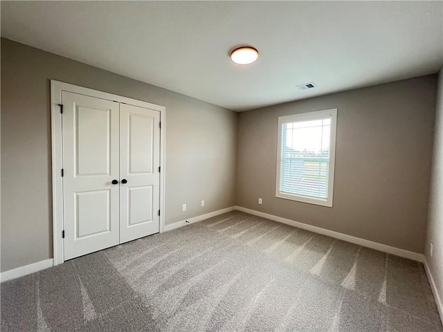 16965 S Mahaffie St, Olathe, KS 66062 - unfurnished bedroom with carpet flooring, baseboards, and a closet