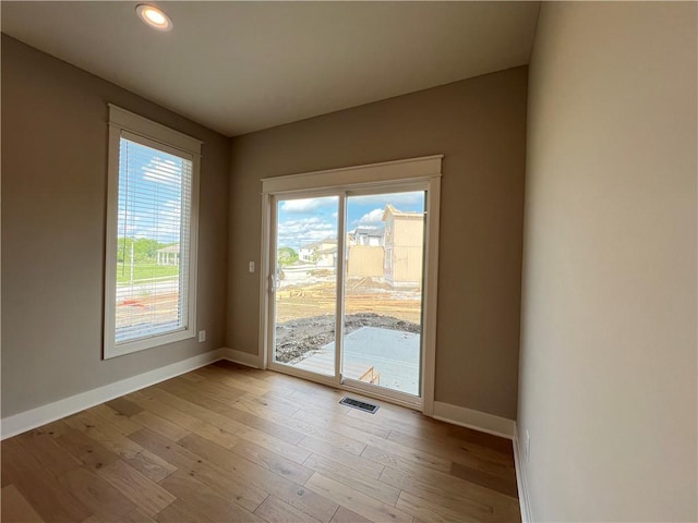 16965 S Mahaffie St, Olathe, KS 66062 - spare room featuring baseboards, light wood finished floors, and recessed lighting