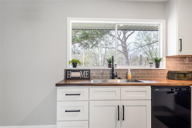 kitchen featuring white cabinets, a sink, tasteful backsplash, and dishwasher