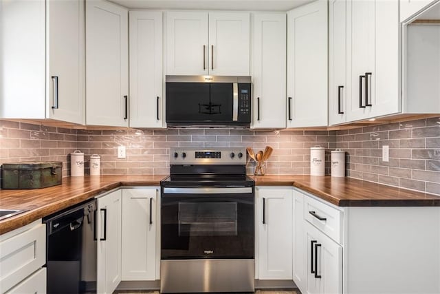 kitchen with white cabinetry, decorative backsplash, appliances with stainless steel finishes, and butcher block counters