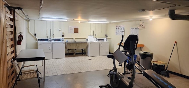 finished below grade area featuring washer and dryer and a sink