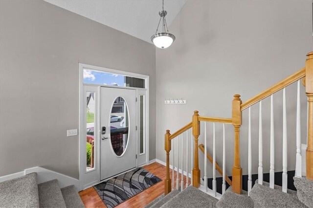 2357 SW Current Ct, Lees Summit, MO 64082 - foyer entrance with baseboards, stairs, and wood finished floors