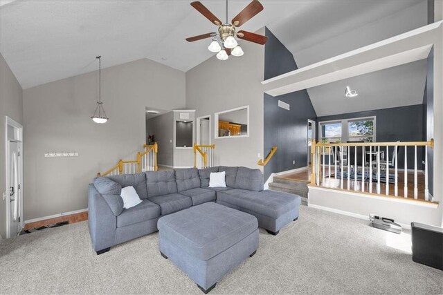 2357 SW Current Ct, Lees Summit, MO 64082 - living room featuring carpet floors, a ceiling fan, baseboards, and high vaulted ceiling