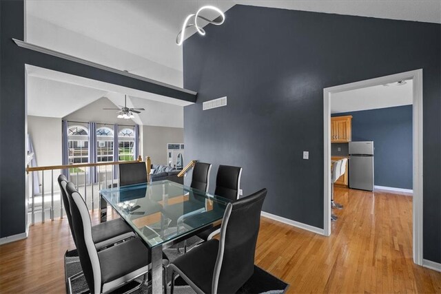 2357 SW Current Ct, Lees Summit, MO 64082 - dining space featuring visible vents, light wood-style flooring, and lofted ceiling