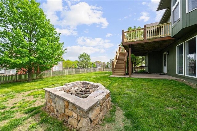 2357 SW Current Ct, Lees Summit, MO 64082 - view of yard featuring a deck, stairway, a fenced backyard, a patio, and a fire pit