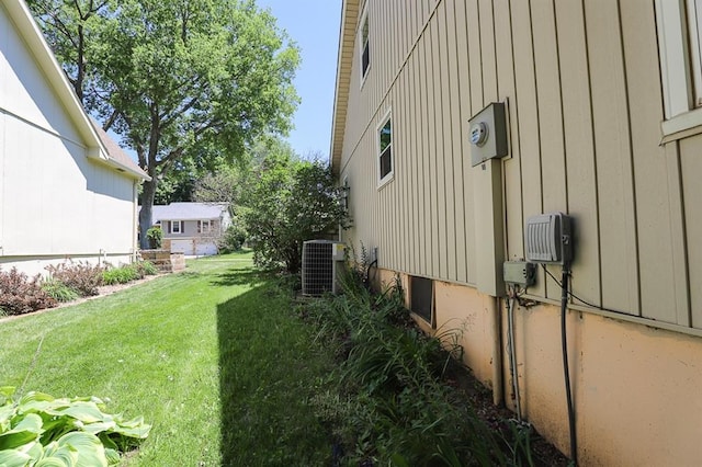 1313 NW 12th St, Blue Springs, MO 64015 - view of grassy yard featuring central air condition unit