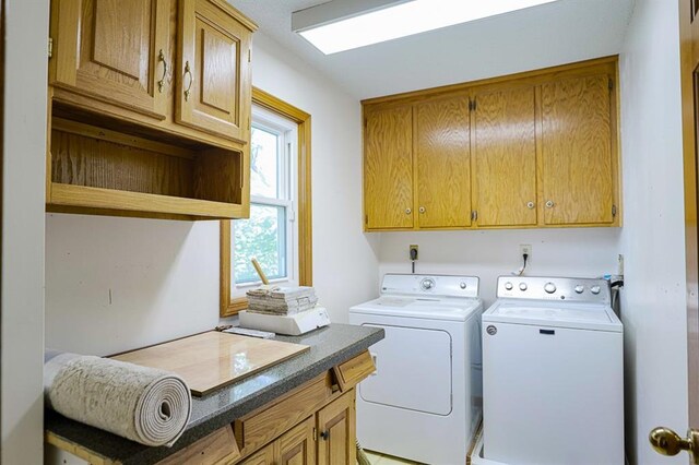 1313 NW 12th St, Blue Springs, MO 64015 - laundry room featuring washing machine and clothes dryer and cabinet space