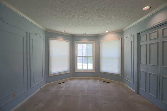 1313 NW 12th St, Blue Springs, MO 64015 - carpeted spare room with recessed lighting, ornamental molding, and a textured ceiling