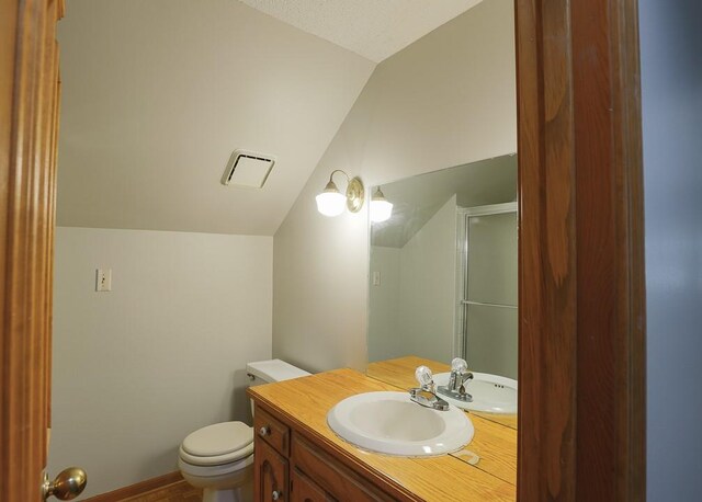 1313 NW 12th St, Blue Springs, MO 64015 - full bath featuring lofted ceiling, vanity, toilet, and a shower with shower door