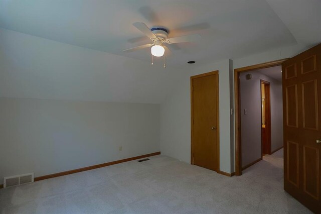 1313 NW 12th St, Blue Springs, MO 64015 - bonus room with a ceiling fan, light carpet, baseboards, and lofted ceiling
