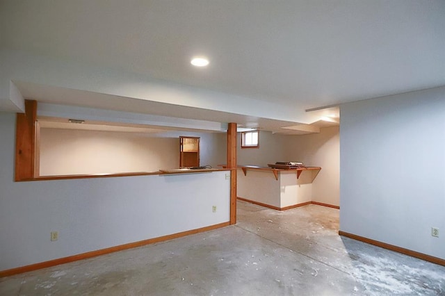 1313 NW 12th St, Blue Springs, MO 64015 - below grade area featuring baseboards and recessed lighting
