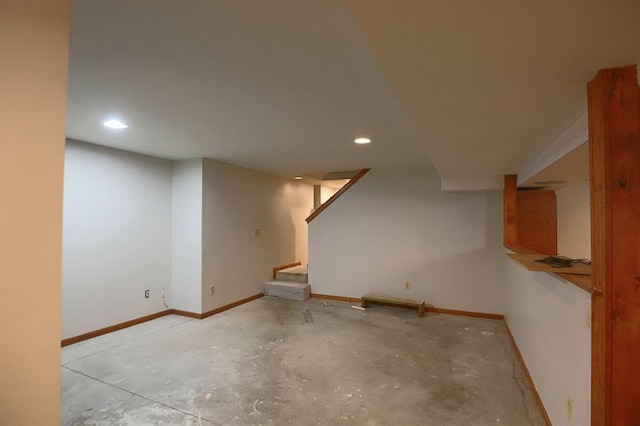 1313 NW 12th St, Blue Springs, MO 64015 - finished below grade area with baseboards, recessed lighting, and stairs