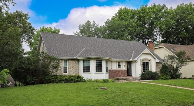 1313 NW 12th St, Blue Springs, MO 64015 - view of front of house with stone siding, a front lawn, and stucco siding