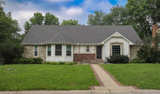 1313 NW 12th St, Blue Springs, MO 64015 - view of front of property featuring stone siding, a front lawn, stucco siding, and roof with shingles