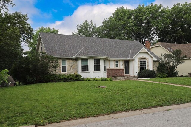 1313 NW 12th St, Blue Springs, MO 64015 - single story home with stone siding, a front yard, and roof with shingles