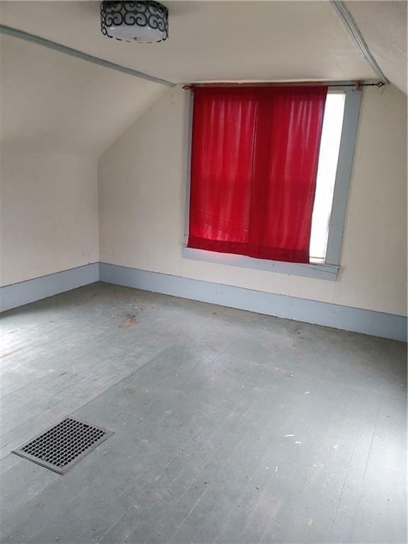 608 E Lake St, Mclouth, KS 66054 - bonus room with plenty of natural light, visible vents, and lofted ceiling