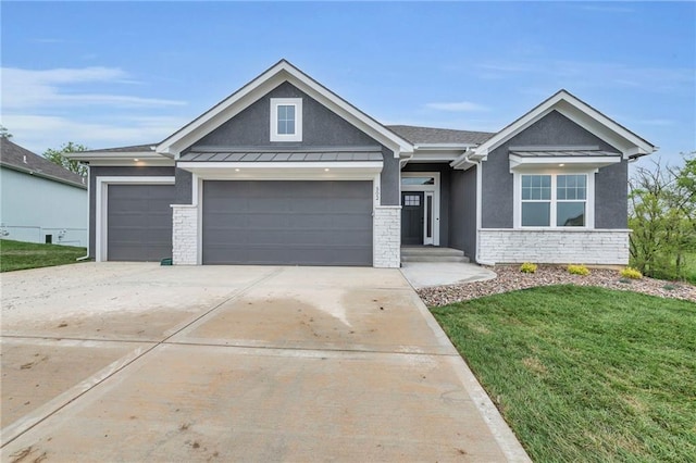 502 Seventh St, Smithville, MO 64089 - view of front of home featuring a garage, a front yard, concrete driveway, stone siding, and a standing seam roof