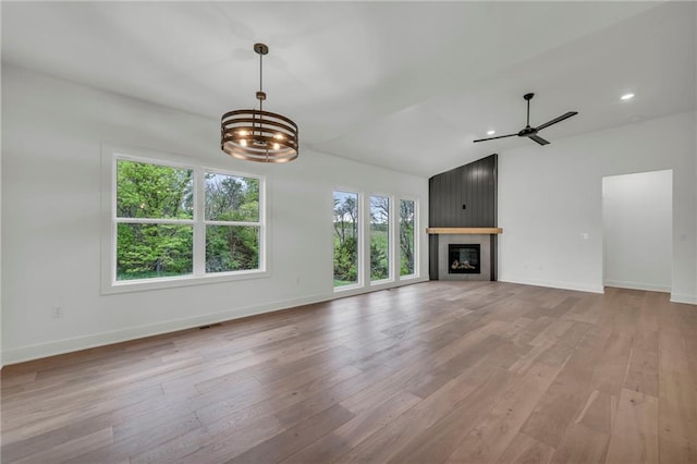 502 Seventh St, Smithville, MO 64089 - unfurnished living room with plenty of natural light, ceiling fan, light wood finished floors, lofted ceiling, and recessed lighting