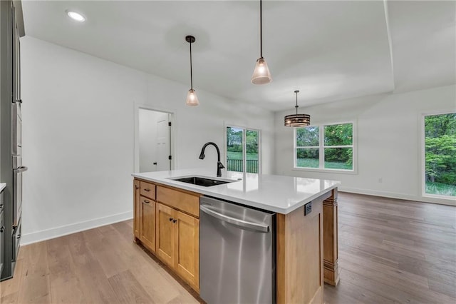 502 Seventh St, Smithville, MO 64089 - kitchen with dishwasher, a sink, plenty of natural light, light wood finished floors, and recessed lighting