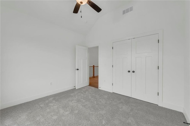 502 Seventh St, Smithville, MO 64089 - unfurnished bedroom with carpet floors, a closet, baseboards, a ceiling fan, and high vaulted ceiling