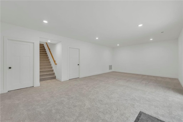 502 Seventh St, Smithville, MO 64089 - finished basement featuring recessed lighting, light colored carpet, stairs, and baseboards
